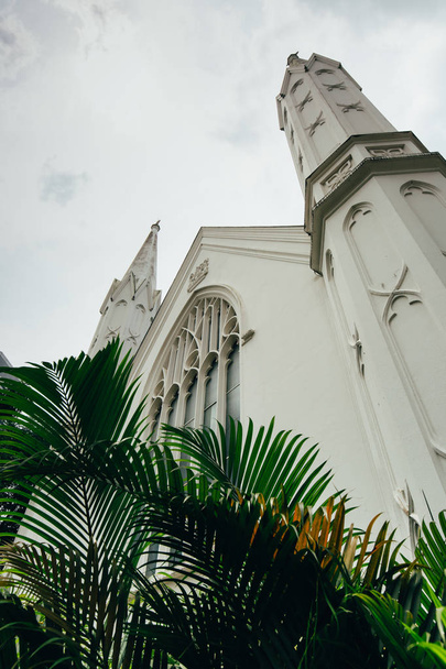 Day scene view of St Andrew's Cathedral old building in Singapore - Foto, imagen