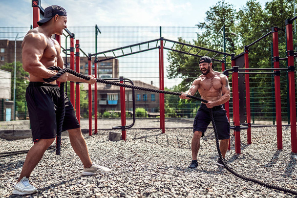 Men with rope, functional training - Фото, изображение