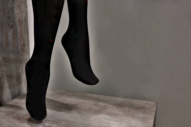 legs of a mannequin in black pantyhose - Foto, immagini