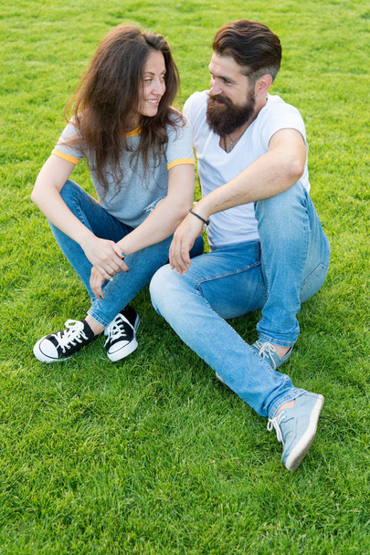 life together. romantic couple having fun together. summer relax in park. couple in love. valentines day. cute girl and bearded man hipster on green grass. perfect date. family weekend - Valokuva, kuva