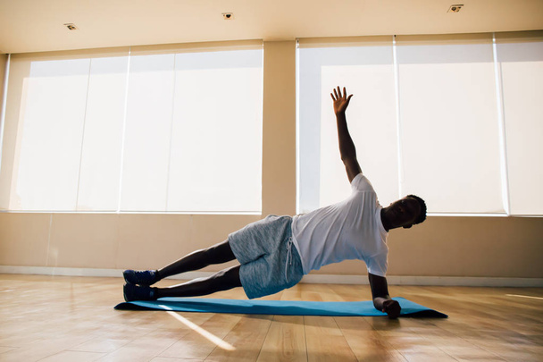 African American sportsman working out in gym - Foto, Bild
