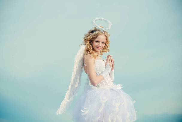 Valentine. Cherub angel pray. Pretty white little girl as the cupid congratulating on St Valentines day. Real fairy from magical stories. Angel children girl with white wings pray. - Fotoğraf, Görsel