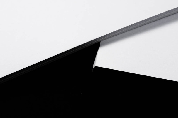 Amount of white sheets of paper on a black background.Back to school. Office. - Foto, afbeelding