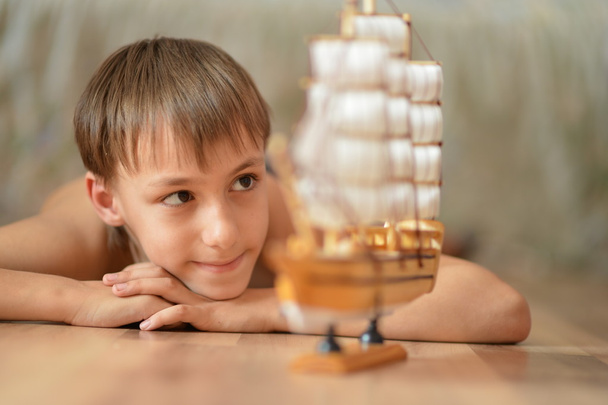 little boy with a toy-ship - Foto, Imagen