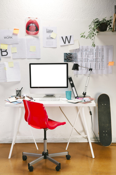 Modern creative workspace with computer and red chair. - Fotografie, Obrázek