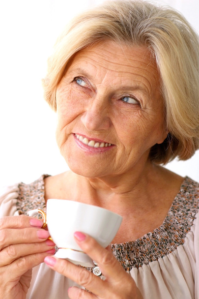 old woman drinking coffee - Foto, Bild