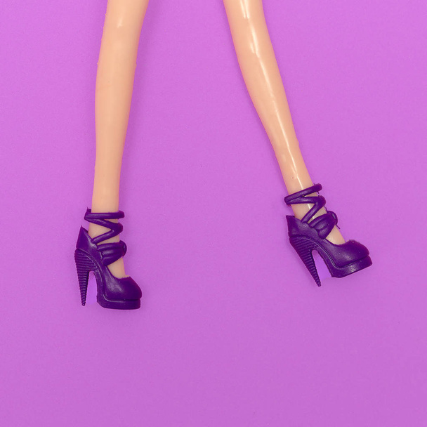 Doll legs in stylish heel shoes. Fashion minimal flat lay art - Fotografie, Obrázek