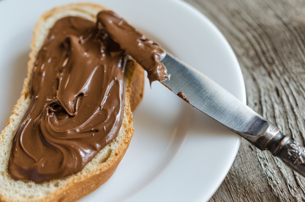 Slice of bread with chocolate cream - Foto, imagen
