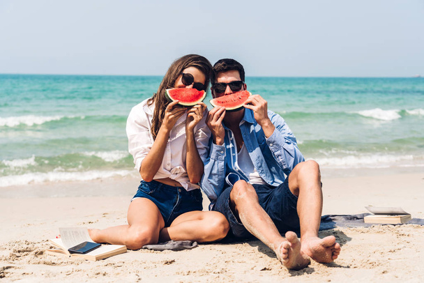 Romantic lovers young couple relaxing holding and eating a slice - Photo, Image