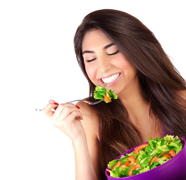 Cute girl eating salad - 写真・画像