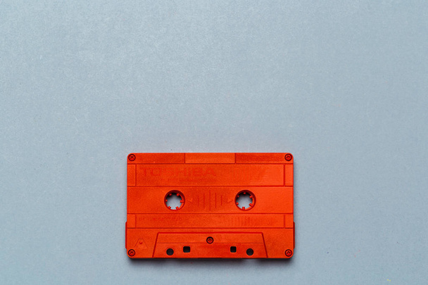 One single retro audio cassette on light grey background, top view - Foto, imagen