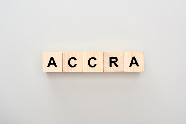 top view of wooden blocks with Accra lettering on grey background - Zdjęcie, obraz