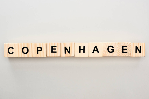 top view of wooden blocks with Copenhagen lettering on grey background - Photo, Image