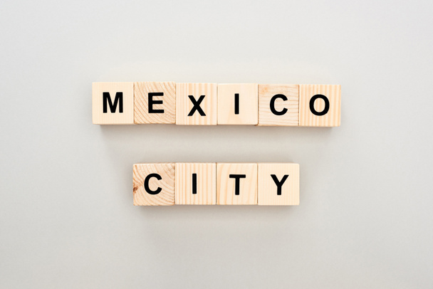 top view of wooden blocks with Mexico City lettering on grey background - Photo, Image