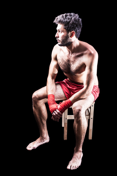 Istuva nyrkkeilijä
 - Valokuva, kuva