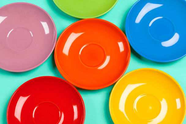 Colorful saucers on a vibrant bright background - Photo, Image