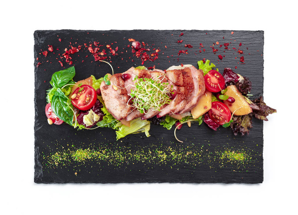 grilled meat : beef ( lamb ) garnished with tomatoes ,lettuce - Fotografie, Obrázek