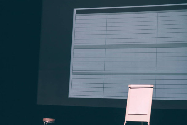 blank screen and flipchart in the conference room. - 写真・画像