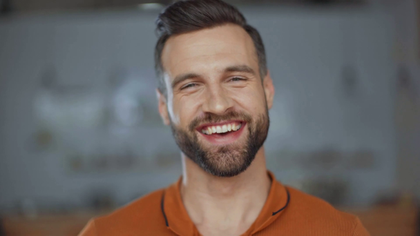 happy handsome man laughing in cafe - Filmagem, Vídeo