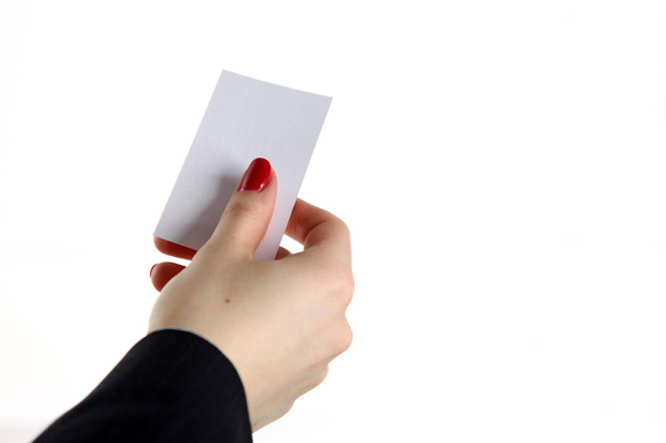 Female hand holding business card in office - Photo, Image