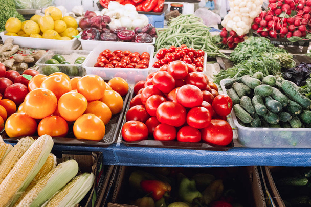big choice of fresh vegetables on market counter - Фото, изображение
