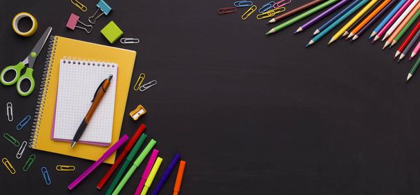 School and office stationery on chalk board background - Photo, Image