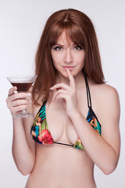 Girl in a swimsuit relaxing with a glass in hand - Fotó, kép