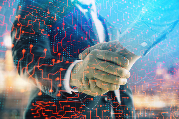 Double exposure of abstract technology drawing on cityscape background with two businessmen handshake. Concept of tech role in business - Fotografie, Obrázek