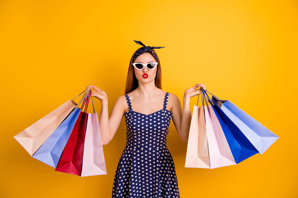Portrait of dreamy student people hold hand bags send air kisses have vacation weekend black friday wear headband isolated yellow background - 写真・画像