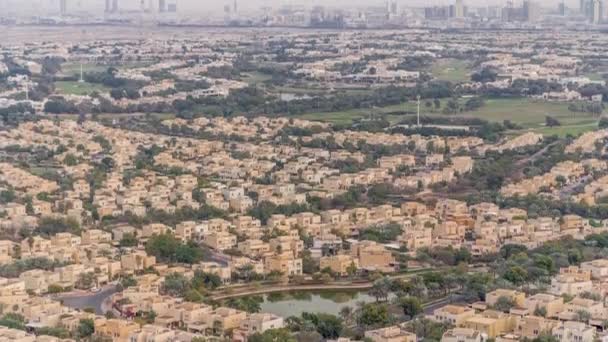 Aerial view of apartment houses and villas in Dubai city timelapse, United Arab Emirates - Filmagem, Vídeo