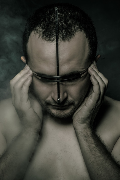 Metal, concept of fear and terror, naked man with hardware in the face - Foto, Imagem