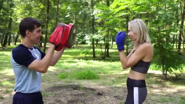 Female boxer training with coach. Womens boxing, sports, training. - Footage, Video