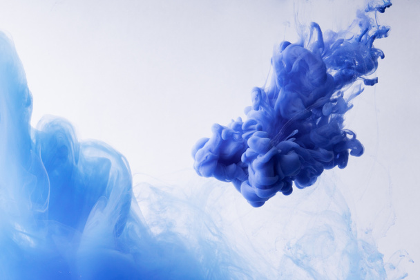 Colorful Ink swirling in water. Cloud of silky ink on white background. - Photo, Image