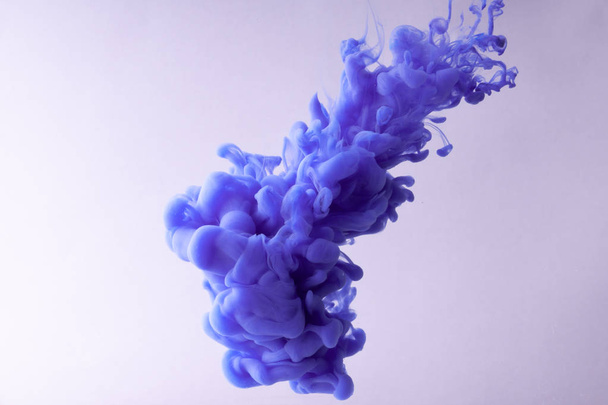 Colorful Ink swirling in water. Cloud of silky ink on white background. - Photo, Image