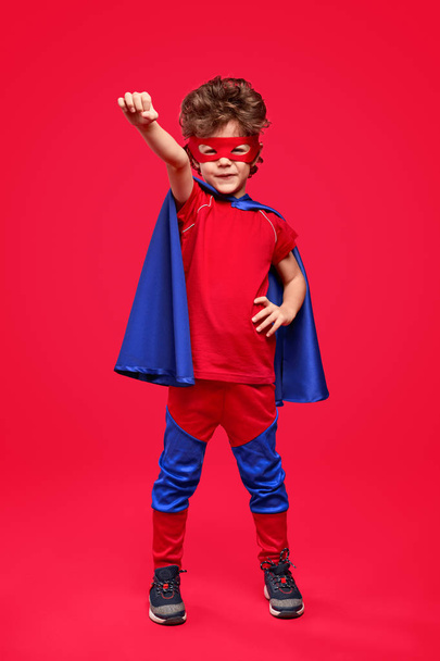 Little superhero in heroic pose - Foto, Imagen