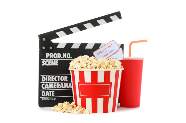 Movie clapper, paper cup, bucket with popcorn and tickets isolat - Photo, Image