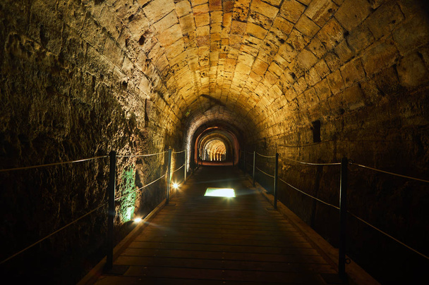 Templars Tunnel Acre. The 12th Century AD tunnel was built by the Crusader Templars to connect their fortress on the south-west side of Acre to the harbor on the south-east side. - Photo, Image