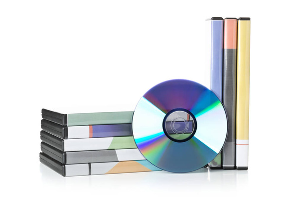 DVD, CD-ROM or Blu-Ray disc with stacked boxes for movies, audio - 写真・画像