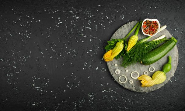Fresh green zucchini on a dark table. The view from the top. Cop - Фото, зображення