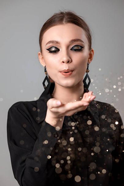 Beautiful young woman with make-up in a black shirt - Φωτογραφία, εικόνα