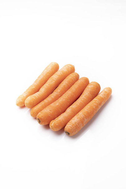 Carrot, young carrot on a white background. - Foto, Imagen