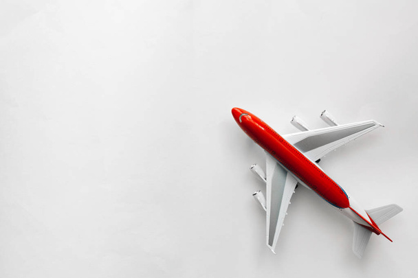 red white plane on white background top view with copy space - Foto, afbeelding