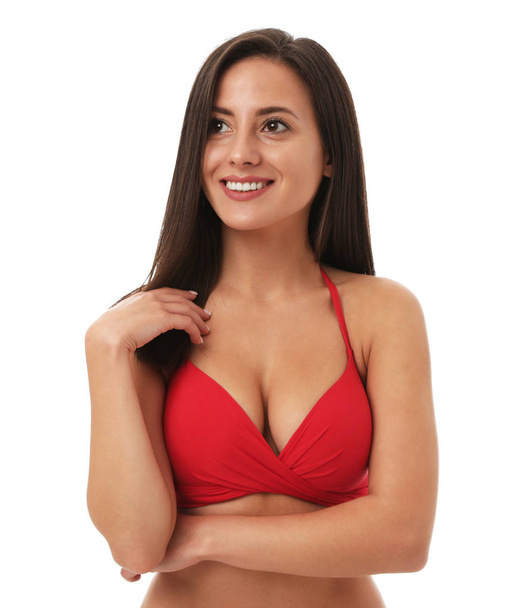Pretty sexy woman with slim body in stylish red bikini on white background - Fotó, kép