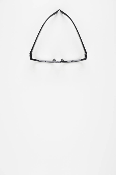top view on eyeglasses over white background - Foto, Imagem