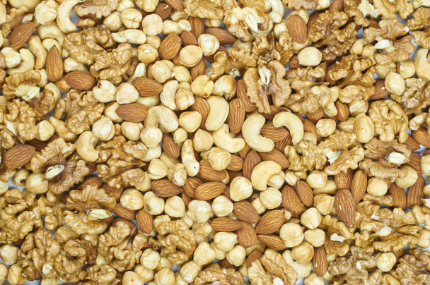 rozijnen noten amandelen cashewnoten hazelnoten Walnut mix schotel textuur - Foto, afbeelding