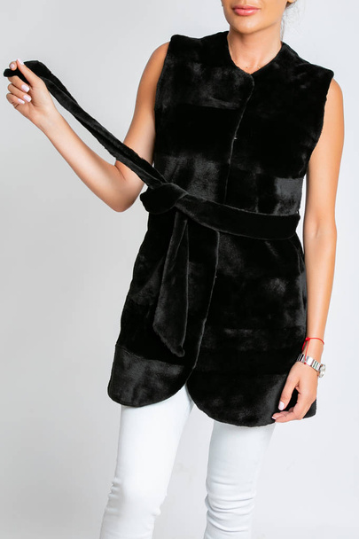 Womens fur vest, black with a belt. - Fotografie, Obrázek