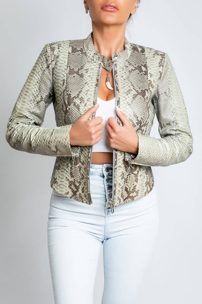 Womens jacket with long sleeves, snake skin, with an iron lock. - Фото, изображение