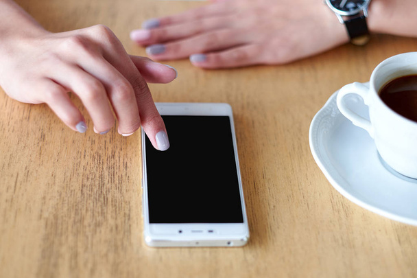 Business woman hands with smart phone and cup of coffee. For Graphic display montage. - Photo, Image