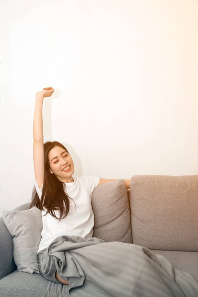 Asian woman relaxed and resting breathing fresh on sofa at home. - Φωτογραφία, εικόνα