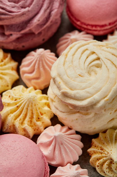 Soft zephyr with small pink and yellow meringues and pink macaroons - Fotografie, Obrázek